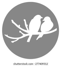 Two birds on a brunch on a gray circle background