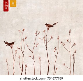 Two birds and young trees branches with fresh leaves on vintage rice paper background. Traditional oriental ink painting sumi-e, u-sin, go-hua. Hieroglyphs - eternity, freedom, happiness, east