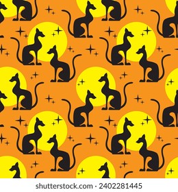 Two black egyptian cats shape silhouette sitting. Colorful sun background. Vector illustration. Seamless pattern.