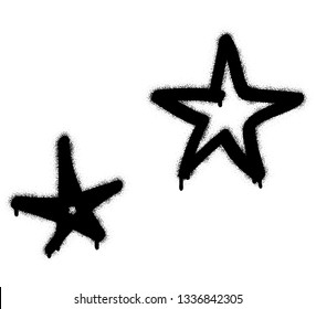 Two black five-point stars. Spray paint graffiti.