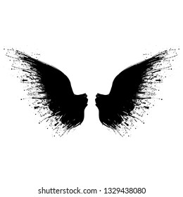 Two black grunge bird wings with ink blots isolated on white background