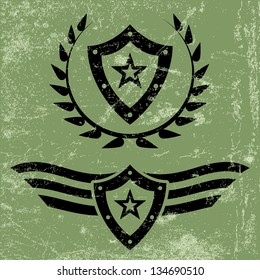 Two black military style grunge emblems with shields and stars