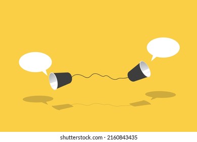 Two black paper cup connect with black rope used for classic phone on yellow background. For old communication system concept.