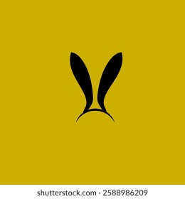 
two black rabbit ears and a dark yellow background