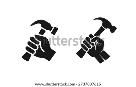 Two black silhouette icons of hands firmly gripping hammers, symbolizing labor, construction, and DIY activities.