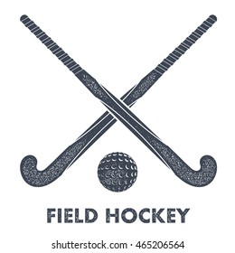 Two black silhouettes sticks for field hockey and ball on a white background with grunge 
texture. Vector illustration.