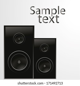 two black speakers with some text in white background