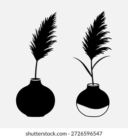 Dois vasos pretos com penas em um fundo branco, um vaso cheio de líquido.
