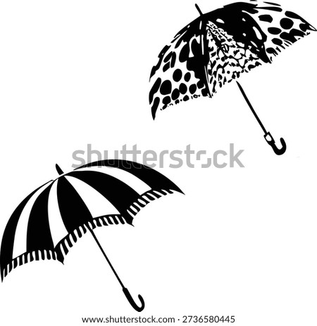 Two black and white umbrellas with different patterns on a white background.eps
