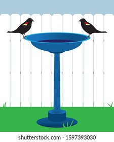 Two blackbirds are standing across from each other on a bird bath