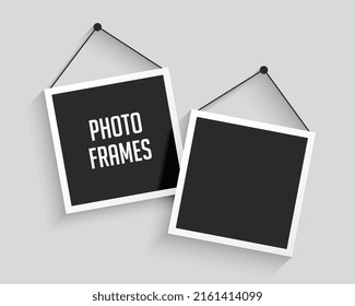 two blank hanging photo frames background