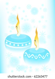 Two blue candles on winter background - New Year concept