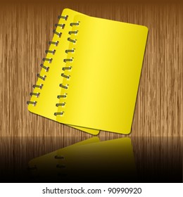Two book and shadow on wooden backgrounds.