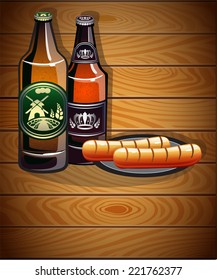 Two bottles of beer and sausages on a wooden background. Abstract Oktoberfest  background 