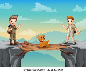 Dos niños exploran con un perro cruzando un puente de madera sobre un acantilado