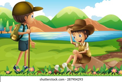 Two boys hiking up the river