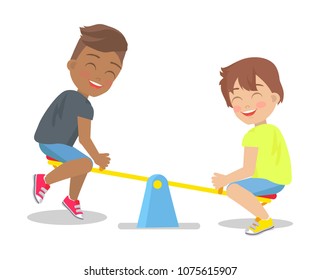 Two boys play on up-and-down carousel for children actually for two persons with seats isolated on white background. Kids have fun on playground