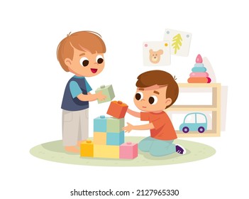 Two boys play together. Educational toys. Educational toys. Children playing designer cubes, developing constructor set.