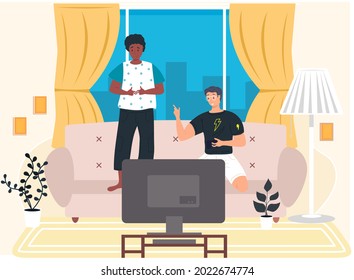 Two boys playing computer video games sitting on couch with gamepad relaxing at home, young people having good time, spending weekend together indoor. Fun leisure time with friends, entertainments