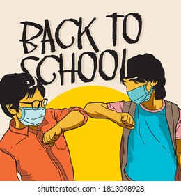 Two boys shake hands during a pandemic