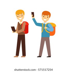 Two Boys Walking From School With Their Backpacks And Smartphones, Person Being Online All The Time Obsessed With Gadget
