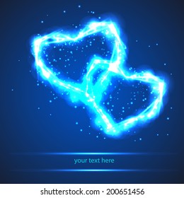 two bright light heart on blue background