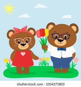 Two brown bears in glasses and clothes in a summer glade. A boy gives tulips to a girl.
