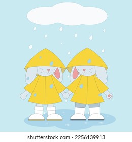 
two bunnies in raincoats stand in the rain