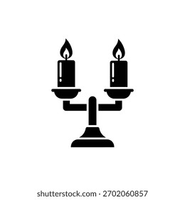 Dos velas ardientes en el icono de Halloween del titular