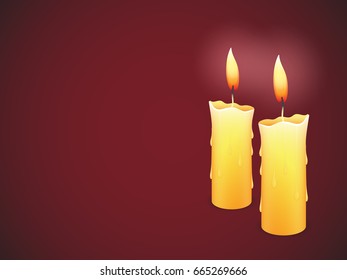 Two burning candles on red background