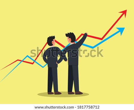 a two business man are looking at the graph while analyzing on a successful business