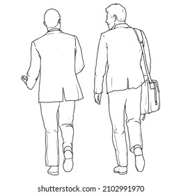 Two business men walking and talking back view