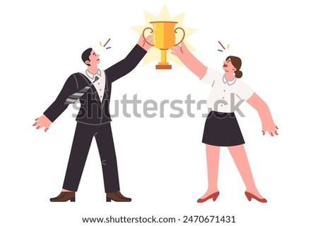 Two business winners together won trophy for professional achievements and successful teamwork. Office employees who demonstrated teamwork celebrate victory in corporate competitions