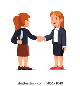 Two business women standing together and shaking each other hands while one holding knife behind her back. Treacherous deal, fraud or betrayal. Hiding killer concept. Flat style  vector illustration.