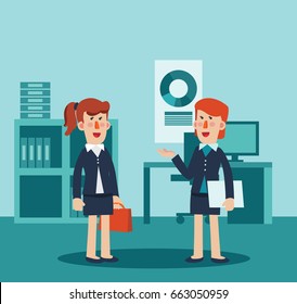 Two business women talking and discussing in office