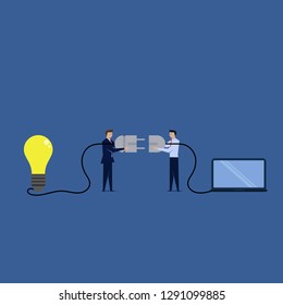 Two businessman plug in the idea and laptop with cable.