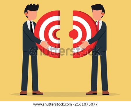 Two businessmen connecting puzzle elements. Business metaphor of a joint venture, partnership or teamwork