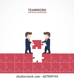 Two businessmen fill the missing puzzle together.