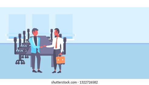 two businessmen shaking hands business men handshake agreement concept successful partnership meeting conference room interior full length horizontal