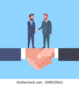 Two Businessmen Shaking Hands On Handshake Business Agreement And Partnership Concept