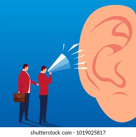 Two businessmen shouting at the huge ears with a megaphone