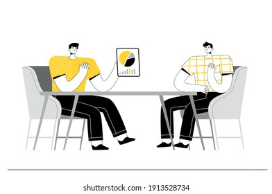 Dos empresarios están sentados a la mesa y discutiendo un nuevo proyecto. Reunión de colegas
