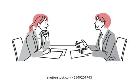 Duas empresárias tendo uma reunião.