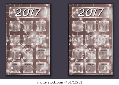 two calendars with abstract bokeh background in 2017 year, beginning with Monday and Sunday