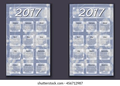 two calendars with abstract bokeh background in 2017 year, beginning with Monday and Sunday