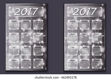 two calendars with abstract bokeh background in 2017 year, beginning with Monday and Sunday