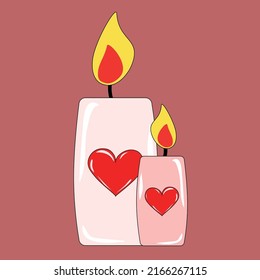 Dos velas con el corazón rojo
