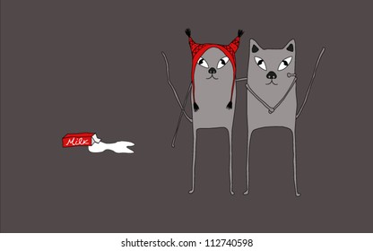 Two cats standing close to each other