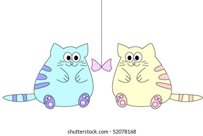 Two cats with a toy