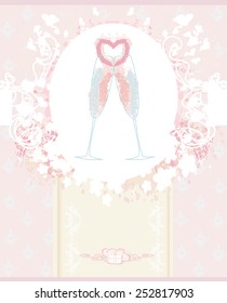Two champagne alcohol cocktails with heart decoration.